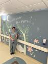 Nurse by painted mural